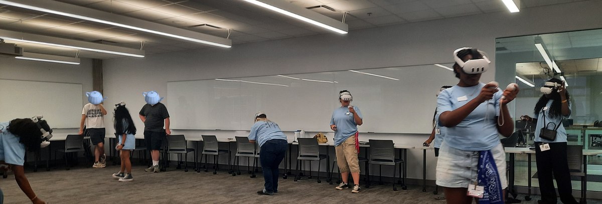 A group of participants in headsets collaborating in a shared mixed-reality space